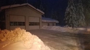 Using graders, King County Roads crews plowed the upper and lower Baring Fire station parking lots so the fire station could operate as an emergency shelter during the days-long power outage in Skykomish.