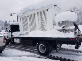 After King County Roads cleared a school parking lot, crews were able to deliver this generator to a school building in snow-covered Skykomish.